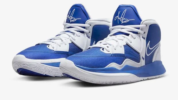 View of blue and white Nike Kyrie shoes.